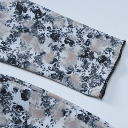 Eleganter, rückenfreier, schmal geschnittener, bedruckter Strampler