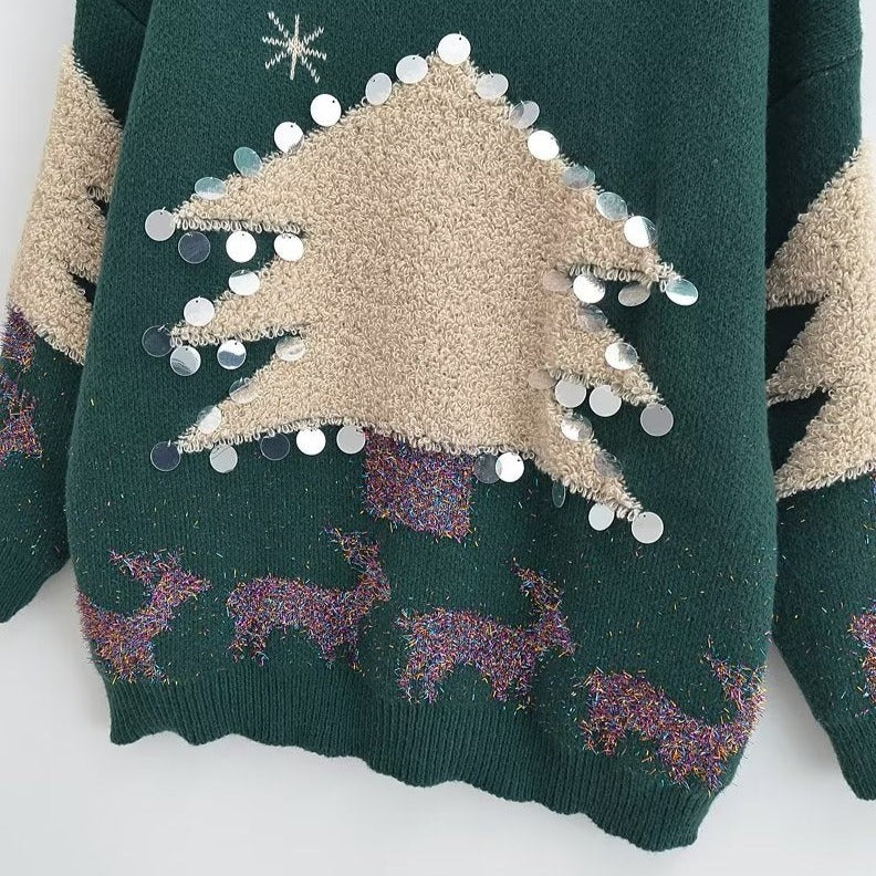 Pull tricoté avec arbre de Noël géant et élan