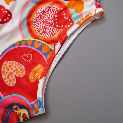 Eleganter, rückenfreier, ärmelloser bedruckter Strampler